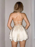Beige Satin Backless Mini Dress with Crisscross Straps and Tiered Skirt
